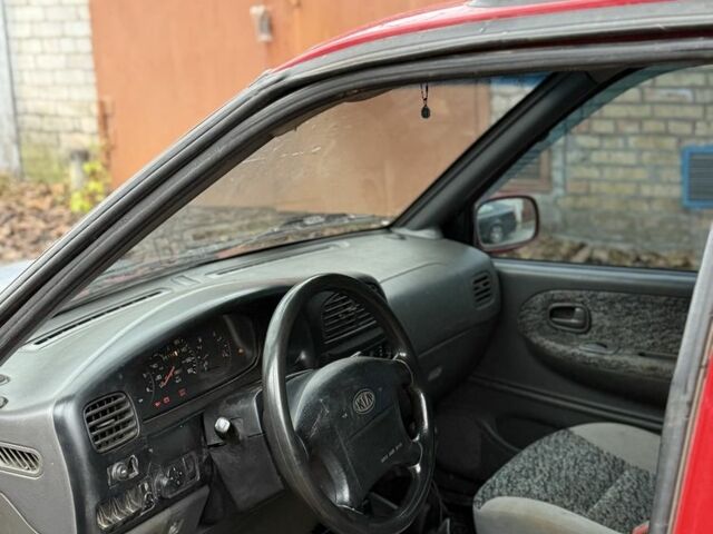 Красный Киа Sportage, объемом двигателя 2 л и пробегом 200 тыс. км за 1000 $, фото 8 на Automoto.ua