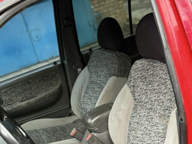 Красный Киа Sportage, объемом двигателя 2 л и пробегом 200 тыс. км за 1000 $, фото 9 на Automoto.ua