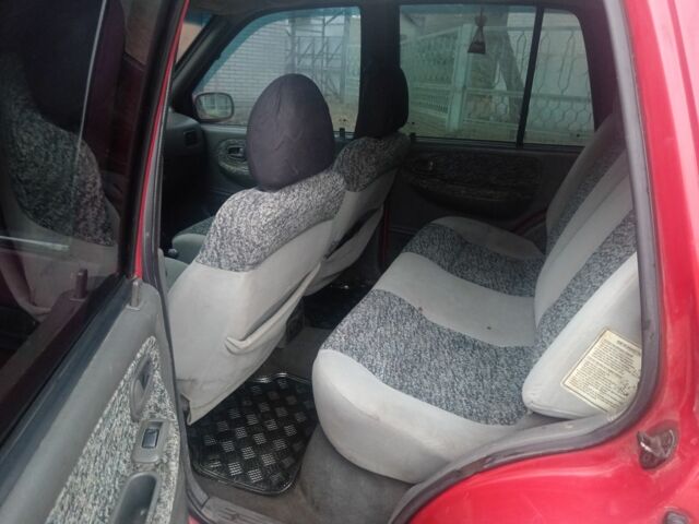 Червоний Кіа Sportage, об'ємом двигуна 2 л та пробігом 200 тис. км за 1310 $, фото 4 на Automoto.ua