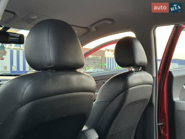 Червоний Кіа Sportage, об'ємом двигуна 2 л та пробігом 150 тис. км за 13500 $, фото 40 на Automoto.ua