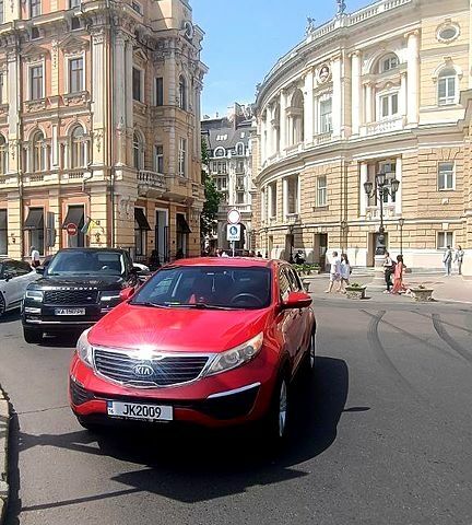Красный Киа Sportage, объемом двигателя 2.4 л и пробегом 300 тыс. км за 10500 $, фото 4 на Automoto.ua