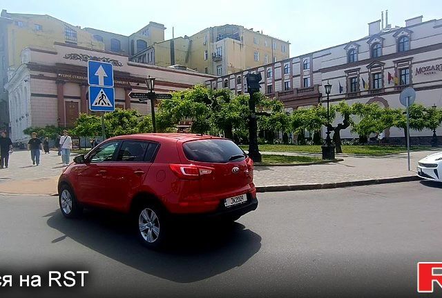 Красный Киа Sportage, объемом двигателя 2.4 л и пробегом 300 тыс. км за 10500 $, фото 7 на Automoto.ua