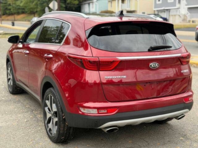 Красный Киа Sportage, объемом двигателя 2 л и пробегом 51 тыс. км за 10000 $, фото 5 на Automoto.ua