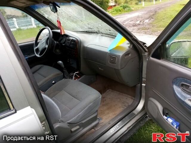 Серый Киа Sportage, объемом двигателя 2 л и пробегом 266 тыс. км за 3200 $, фото 10 на Automoto.ua