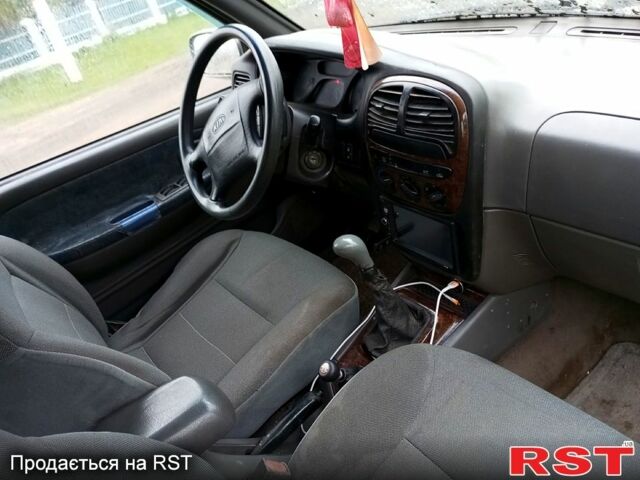 Серый Киа Sportage, объемом двигателя 2 л и пробегом 266 тыс. км за 3200 $, фото 11 на Automoto.ua