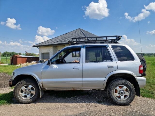 Серый Киа Sportage, объемом двигателя 2 л и пробегом 300 тыс. км за 4500 $, фото 12 на Automoto.ua