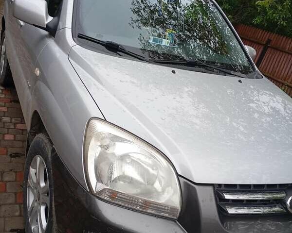 Серый Киа Sportage, объемом двигателя 2 л и пробегом 200 тыс. км за 6500 $, фото 4 на Automoto.ua