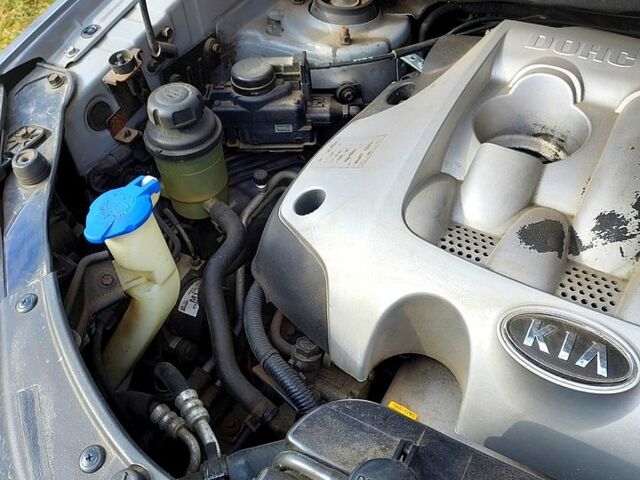 Сірий Кіа Sportage, об'ємом двигуна 2 л та пробігом 215 тис. км за 8350 $, фото 5 на Automoto.ua