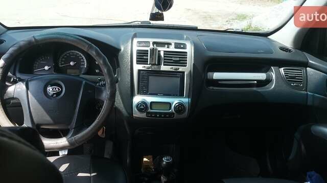Серый Киа Sportage, объемом двигателя 2 л и пробегом 320 тыс. км за 6500 $, фото 4 на Automoto.ua