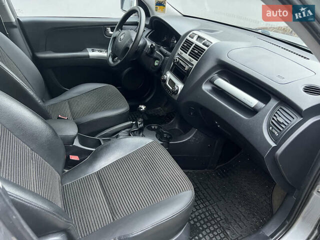 Серый Киа Sportage, объемом двигателя 2 л и пробегом 270 тыс. км за 6599 $, фото 14 на Automoto.ua