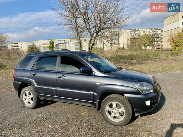Серый Киа Sportage, объемом двигателя 2 л и пробегом 261 тыс. км за 6700 $, фото 2 на Automoto.ua