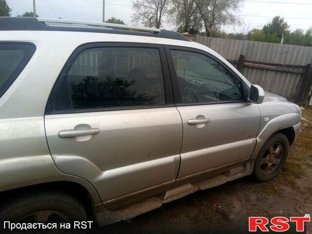 Серый Киа Sportage, объемом двигателя 2 л и пробегом 246 тыс. км за 8000 $, фото 4 на Automoto.ua