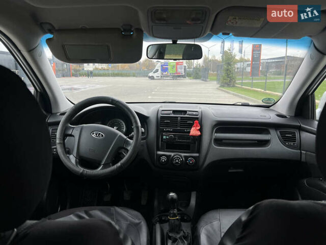 Серый Киа Sportage, объемом двигателя 1.99 л и пробегом 230 тыс. км за 8000 $, фото 13 на Automoto.ua