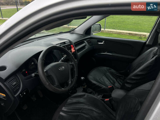 Серый Киа Sportage, объемом двигателя 1.99 л и пробегом 230 тыс. км за 8000 $, фото 17 на Automoto.ua