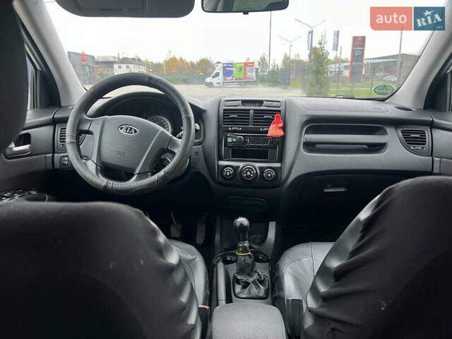 Серый Киа Sportage, объемом двигателя 1.99 л и пробегом 230 тыс. км за 8000 $, фото 14 на Automoto.ua