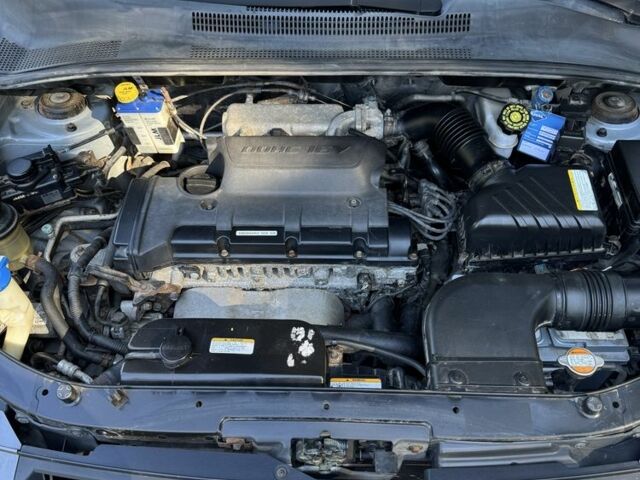 Серый Киа Sportage, объемом двигателя 2 л и пробегом 206 тыс. км за 8900 $, фото 22 на Automoto.ua