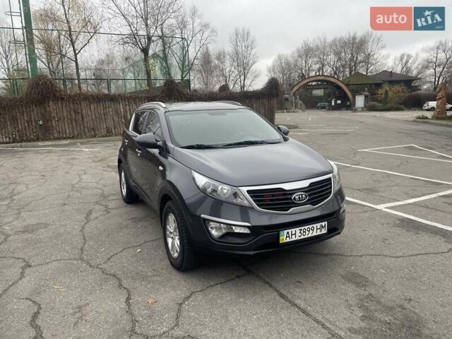 Серый Киа Sportage, объемом двигателя 2 л и пробегом 77 тыс. км за 12500 $, фото 2 на Automoto.ua