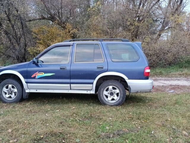 Синий Киа Sportage, объемом двигателя 2 л и пробегом 210 тыс. км за 3300 $, фото 6 на Automoto.ua