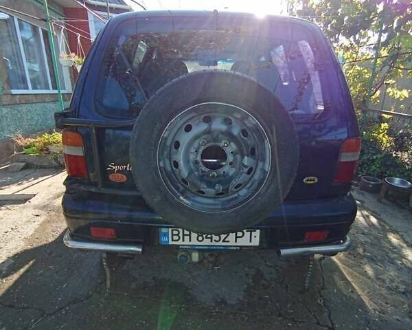Синий Киа Sportage, объемом двигателя 2 л и пробегом 250 тыс. км за 2999 $, фото 1 на Automoto.ua