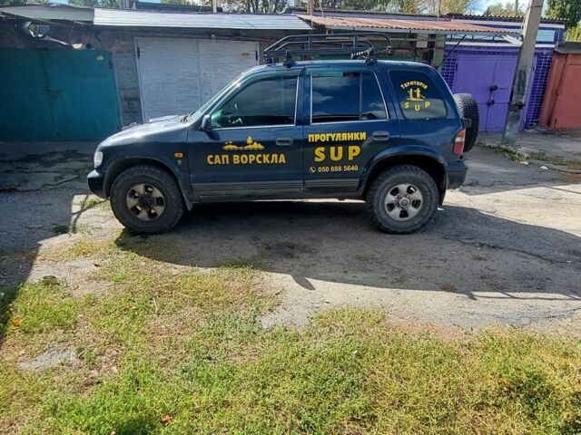 Синий Киа Sportage, объемом двигателя 2 л и пробегом 400 тыс. км за 4000 $, фото 2 на Automoto.ua