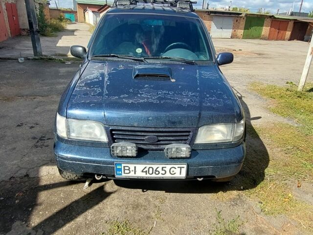 Синий Киа Sportage, объемом двигателя 2 л и пробегом 400 тыс. км за 4000 $, фото 5 на Automoto.ua