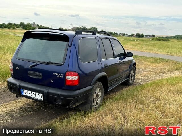 Синій Кіа Sportage, об'ємом двигуна 2 л та пробігом 200 тис. км за 3500 $, фото 3 на Automoto.ua