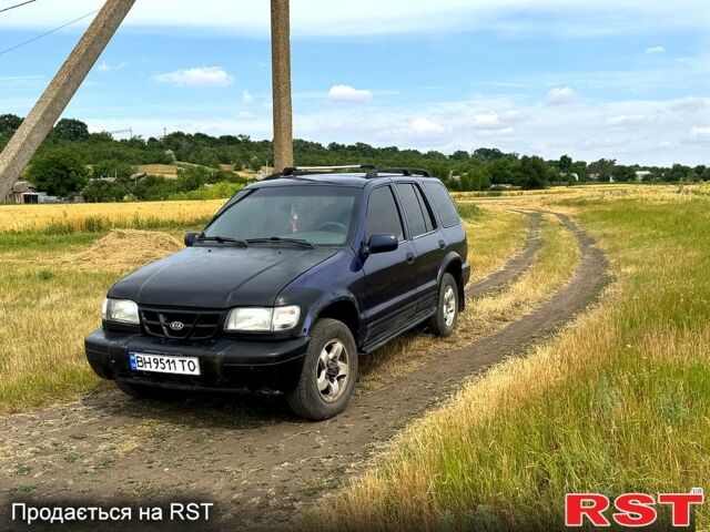 Синій Кіа Sportage, об'ємом двигуна 2 л та пробігом 200 тис. км за 3500 $, фото 1 на Automoto.ua