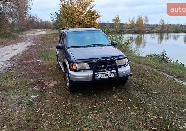 Синий Киа Sportage, объемом двигателя 2 л и пробегом 210 тыс. км за 3300 $, фото 2 на Automoto.ua