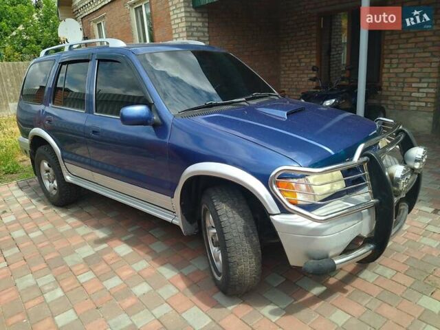 Синій Кіа Sportage, об'ємом двигуна 2 л та пробігом 200 тис. км за 3100 $, фото 1 на Automoto.ua