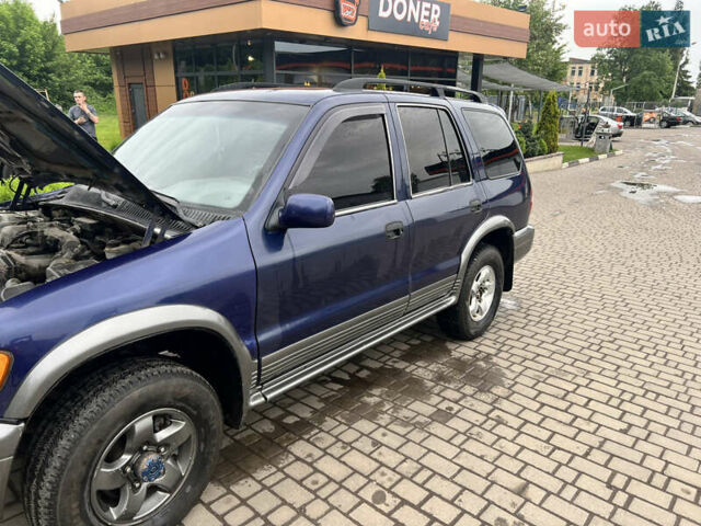 Синий Киа Sportage, объемом двигателя 2 л и пробегом 340 тыс. км за 4500 $, фото 2 на Automoto.ua