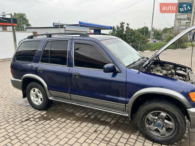 Синий Киа Sportage, объемом двигателя 2 л и пробегом 340 тыс. км за 4500 $, фото 3 на Automoto.ua