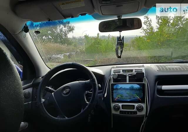 Синий Киа Sportage, объемом двигателя 2 л и пробегом 238 тыс. км за 8500 $, фото 9 на Automoto.ua