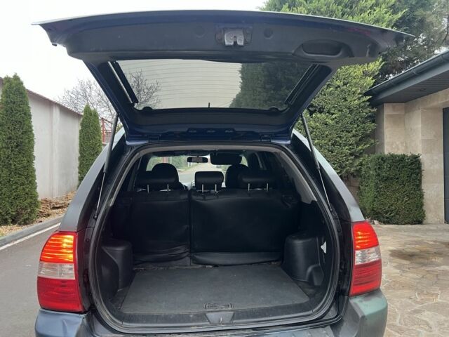 Синий Киа Sportage, объемом двигателя 2 л и пробегом 200 тыс. км за 4300 $, фото 3 на Automoto.ua