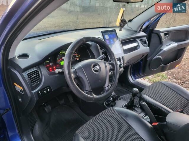 Синий Киа Sportage, объемом двигателя 1.98 л и пробегом 258 тыс. км за 7400 $, фото 104 на Automoto.ua