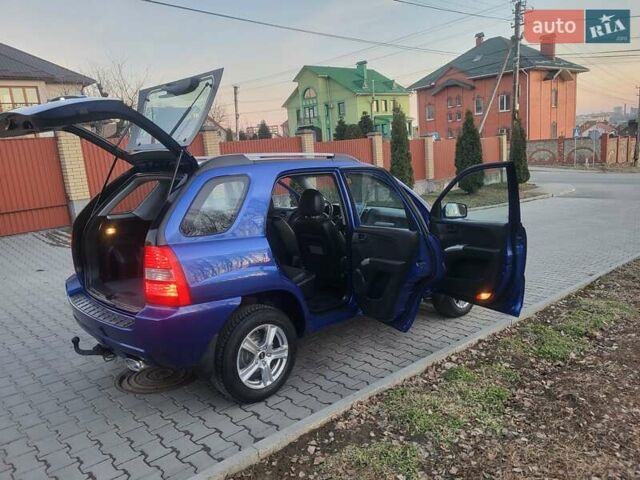 Синий Киа Sportage, объемом двигателя 1.98 л и пробегом 258 тыс. км за 7400 $, фото 61 на Automoto.ua
