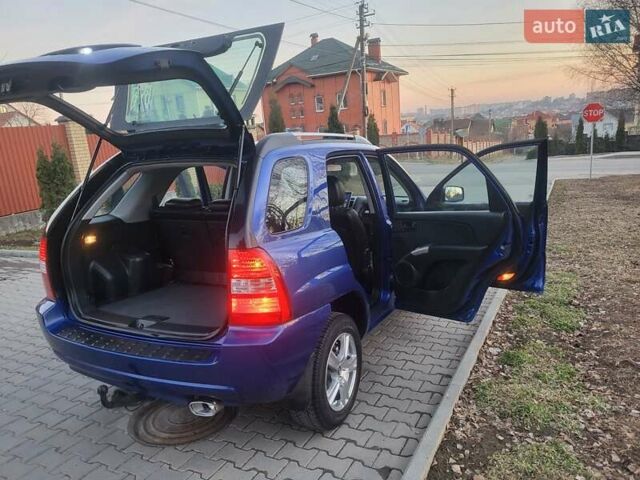 Синий Киа Sportage, объемом двигателя 1.98 л и пробегом 258 тыс. км за 7400 $, фото 60 на Automoto.ua