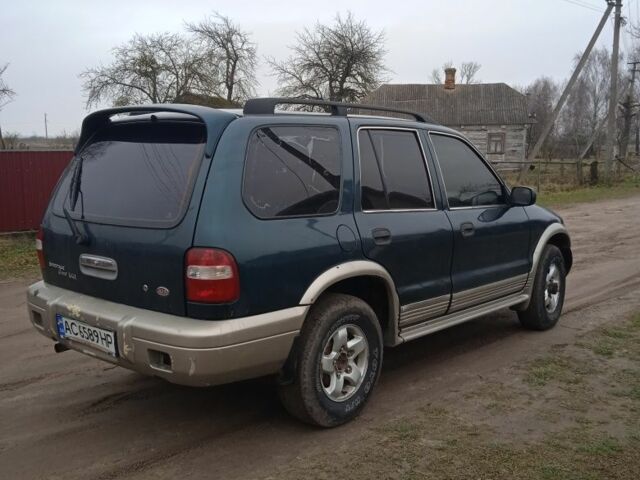 Зеленый Киа Sportage, объемом двигателя 2 л и пробегом 315 тыс. км за 3077 $, фото 1 на Automoto.ua