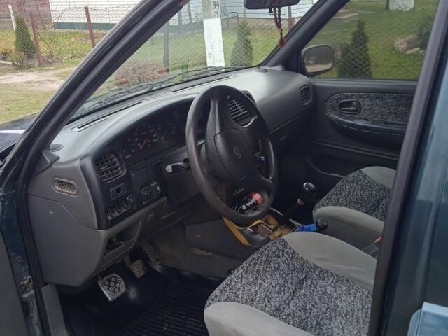 Зеленый Киа Sportage, объемом двигателя 2 л и пробегом 315 тыс. км за 3077 $, фото 2 на Automoto.ua