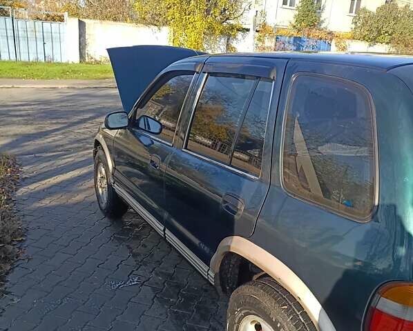 Зеленый Киа Sportage, объемом двигателя 2 л и пробегом 365 тыс. км за 4000 $, фото 3 на Automoto.ua