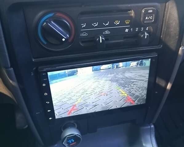 Зеленый Киа Sportage, объемом двигателя 2 л и пробегом 365 тыс. км за 4000 $, фото 11 на Automoto.ua