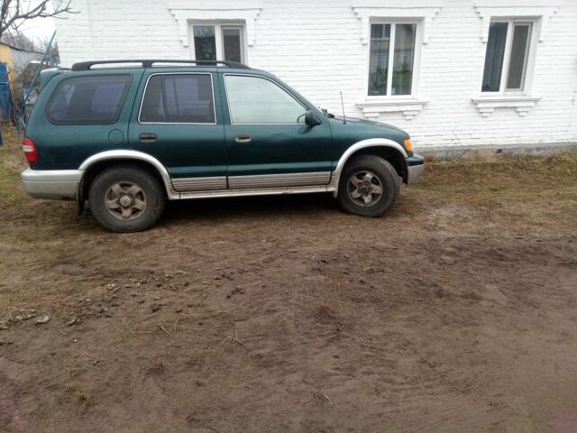 Зелений Кіа Sportage, об'ємом двигуна 2 л та пробігом 198 тис. км за 3900 $, фото 4 на Automoto.ua