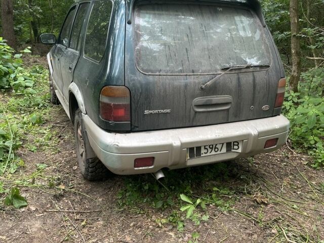 Зеленый Киа Sportage, объемом двигателя 2 л и пробегом 300 тыс. км за 3000 $, фото 1 на Automoto.ua