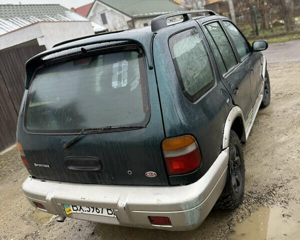 Зеленый Киа Sportage, объемом двигателя 2 л и пробегом 300 тыс. км за 3700 $, фото 3 на Automoto.ua