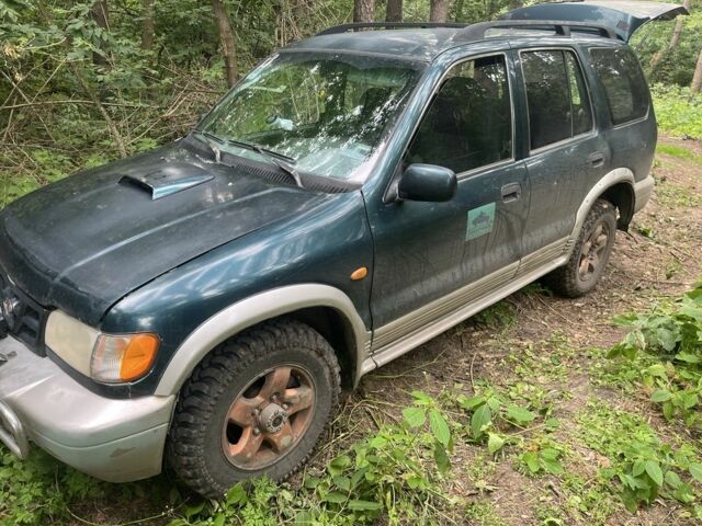 Зеленый Киа Sportage, объемом двигателя 2 л и пробегом 300 тыс. км за 3000 $, фото 2 на Automoto.ua