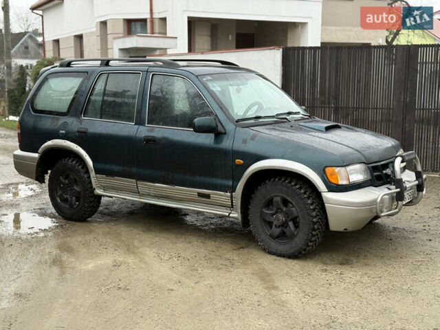 Зеленый Киа Sportage, объемом двигателя 2 л и пробегом 300 тыс. км за 3700 $, фото 6 на Automoto.ua