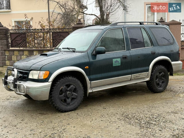 Зеленый Киа Sportage, объемом двигателя 2 л и пробегом 300 тыс. км за 3700 $, фото 1 на Automoto.ua