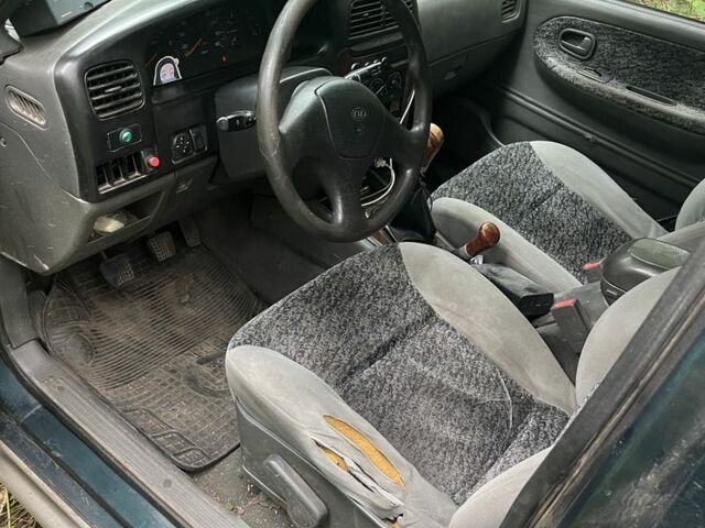 Зеленый Киа Sportage, объемом двигателя 2 л и пробегом 300 тыс. км за 3000 $, фото 4 на Automoto.ua