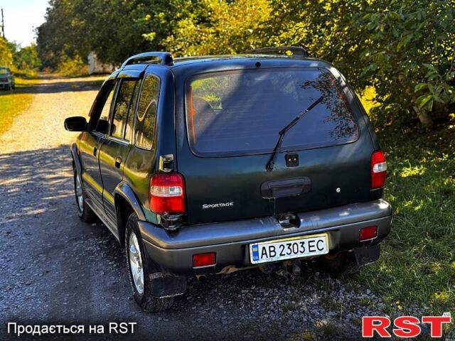Зеленый Киа Sportage, объемом двигателя 2 л и пробегом 200 тыс. км за 3300 $, фото 1 на Automoto.ua
