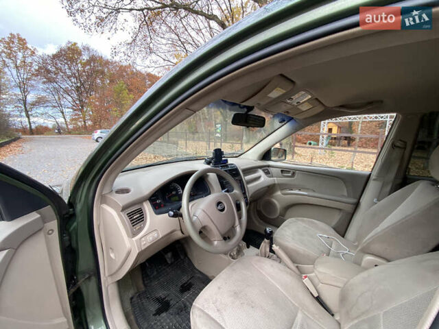 Зеленый Киа Sportage, объемом двигателя 2 л и пробегом 300 тыс. км за 3750 $, фото 21 на Automoto.ua