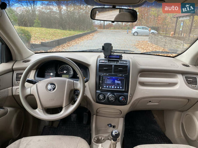 Зеленый Киа Sportage, объемом двигателя 2 л и пробегом 300 тыс. км за 3750 $, фото 25 на Automoto.ua